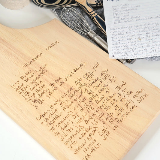 Handwritten recipe on a wooden cutting board, featuring  handwriting from a family member or loved one. 