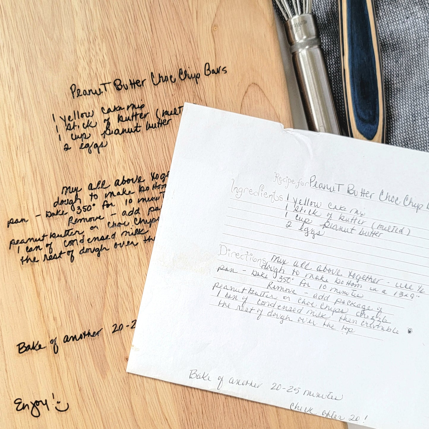 Handwritten recipe on a wooden cutting board, featuring  handwriting from a family member or loved one. 